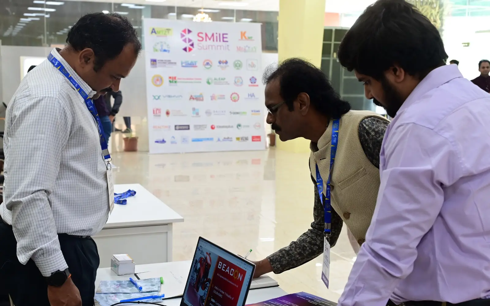 Entrepreneurs discussing a product during SMilE Summit